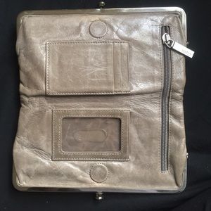 Hobo wallet with one loose hinge.