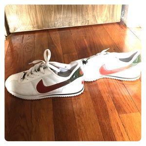 White Nike's with orange and green swoosh!