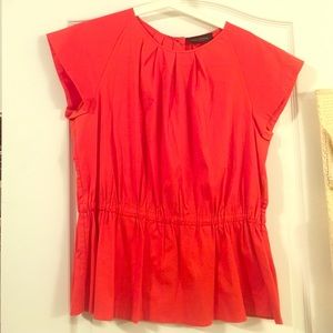 Bright orange blouse