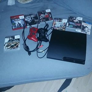 Ps3 with  2 wireless controllers and 7 games.