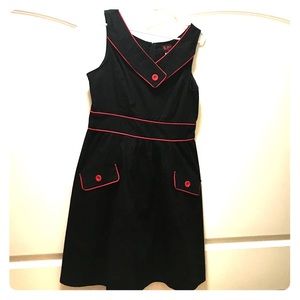 Cute black dress with red trim.