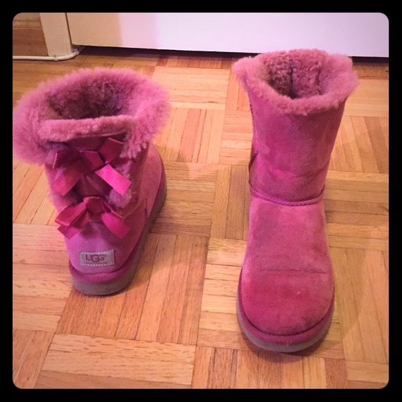 Pink uggs with bows on back