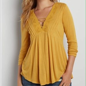 Tee with lace up v-neck crochet inlay