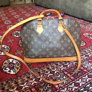 Louis Vuitton alma with cross body straps