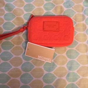 Orange Michael Kors wristlet