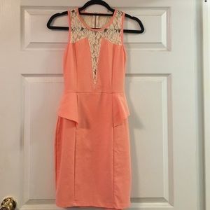 Elegant, coral peplum style dress
