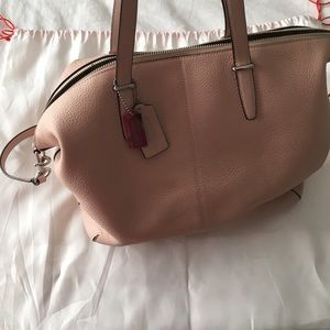 Blush colored coach purse