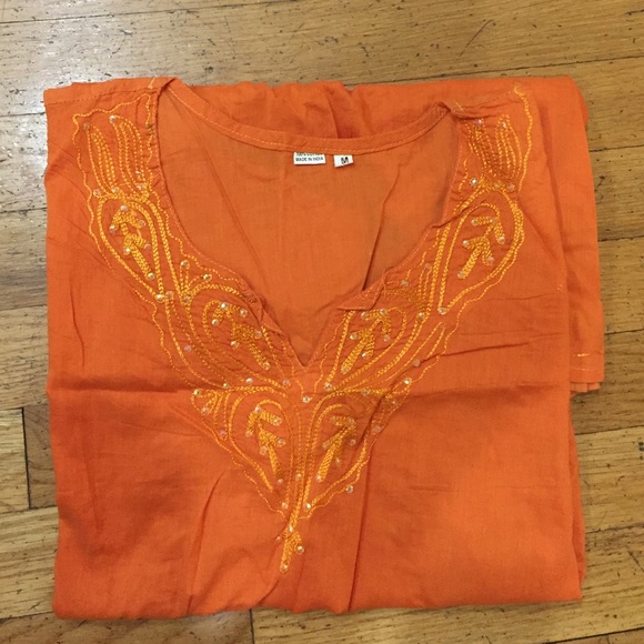 Woman orange detailed shirt