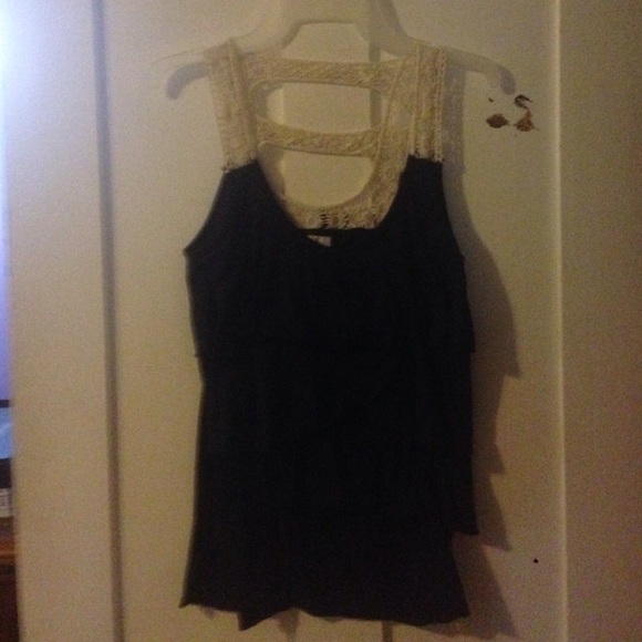 Nice beautiful tank top with ruffles on it.