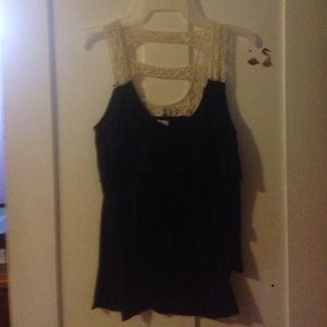 Nice beautiful tank top with ruffles on it.