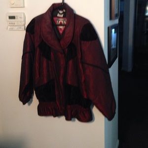 Wine color jacket with velour trim.