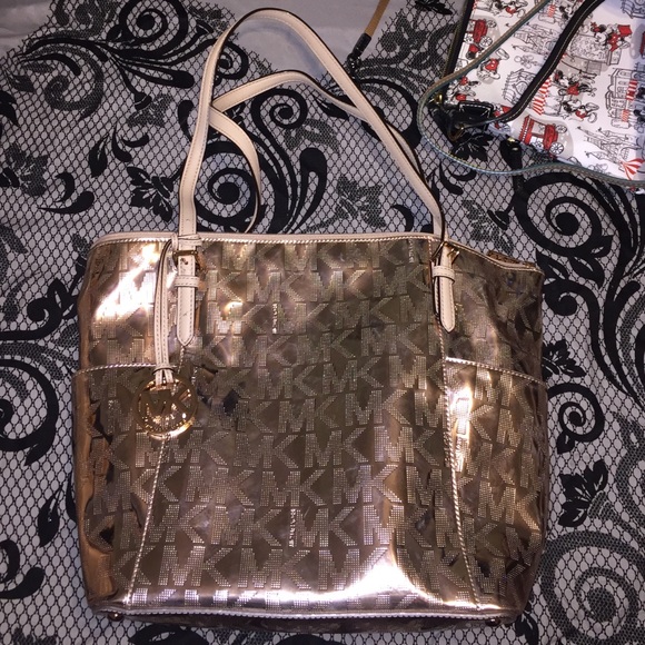 Rose gold Michael Kors purse