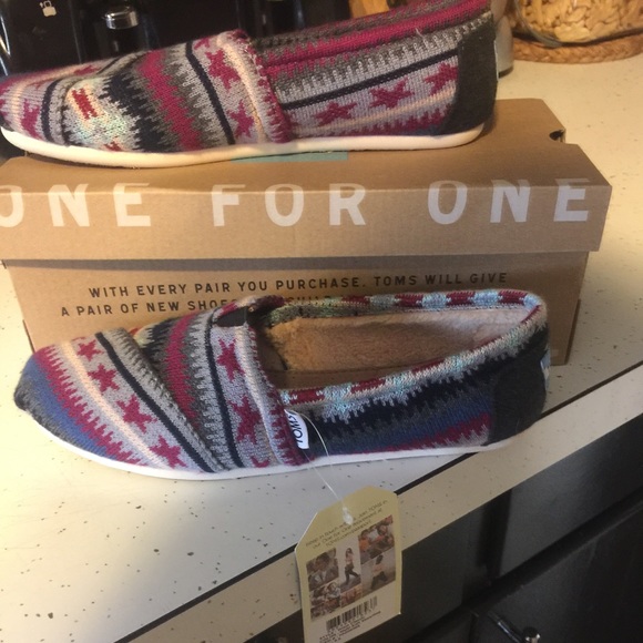Brand new toms in box