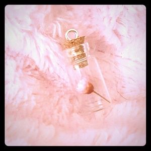 Flower in a bottle pendant