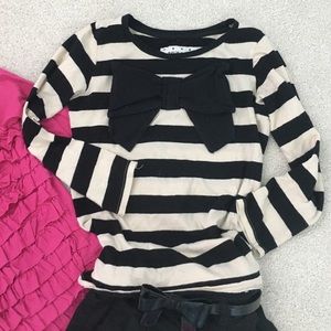 Two girls dress outfits with belt and tights.