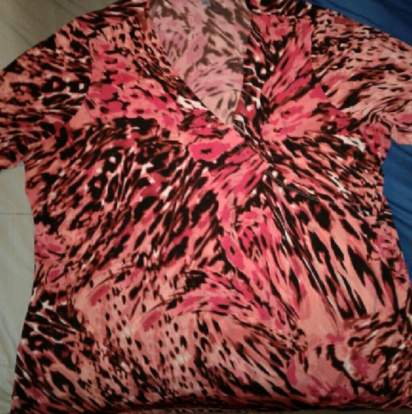 Jennifer Lopez  pink and black low cut blouse