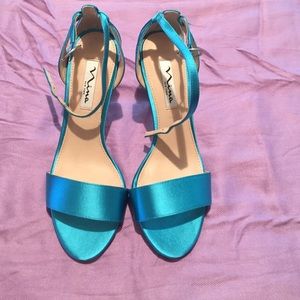 Nina, aquamarine, size 7, brand new.