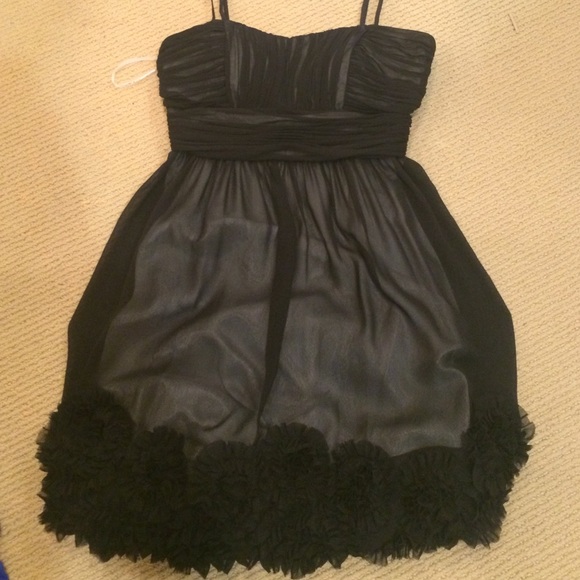 Strapless black dress with nude slip