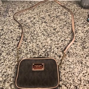 Gently used Michael Kors small cross-body bag.