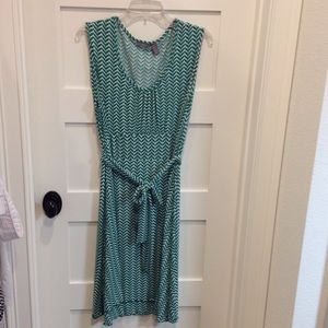 Patterned sleeveless dress, faux wrap skirt