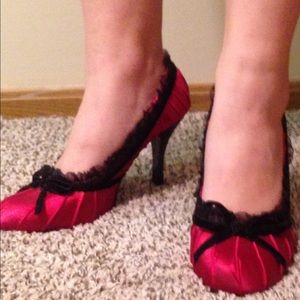Red pumps with black lace trim