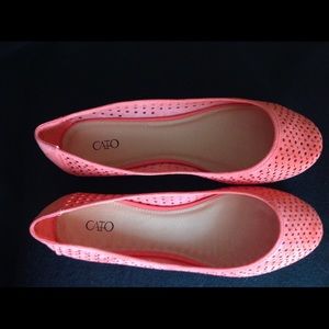 Coral flats with gold accents.