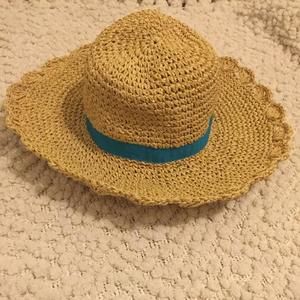 Straw hat with blue ribbon