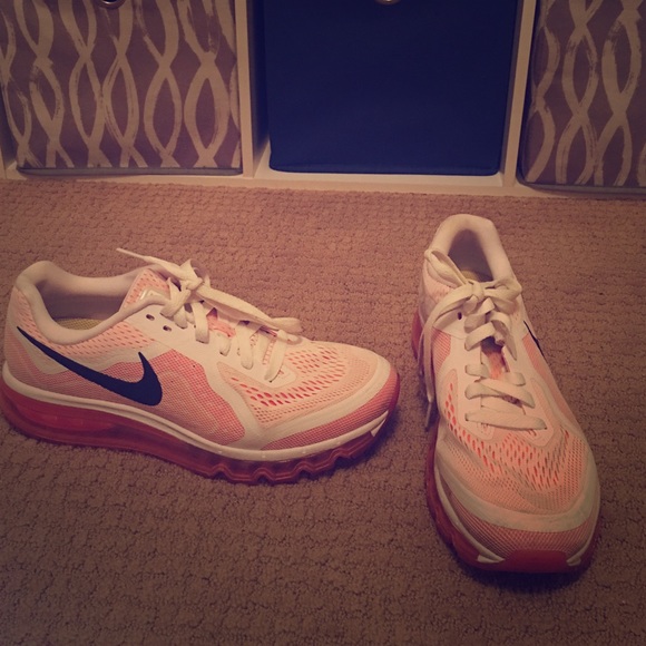 Nike pink and white AirMax shoes.