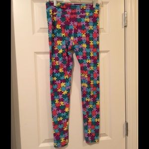 LuLa Roe OS Multi color puzzle piece leggings.