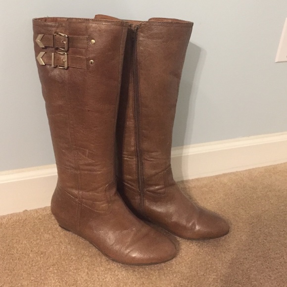 Tall brown boots with buckles