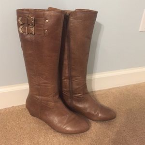 Tall brown boots with buckles