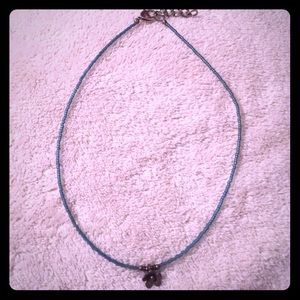 Beaded teal choker with brass flower