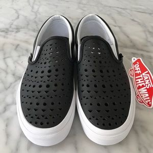 Never worn, black leather Geometric Slip-On.