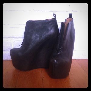 99 - Two leather wedge ankle boot
