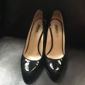 Prada black patent almond toe pumps