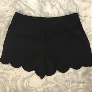 black scallop shorts