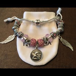 PANDORA Engraved Bracelet with charms and pouch.