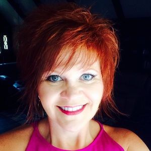 Leopard print tank with red satin waist tie.