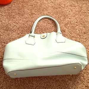 Grey cross body and baby blue purses.