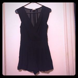 Black sleeveless romper with sheer back