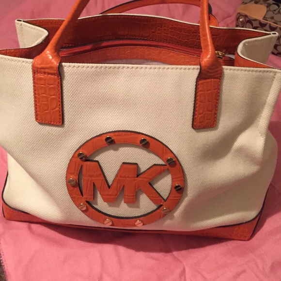 Orange/ivory almost new Michael Kors purse.