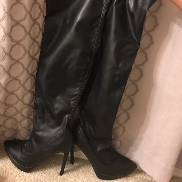 Thigh high black boots