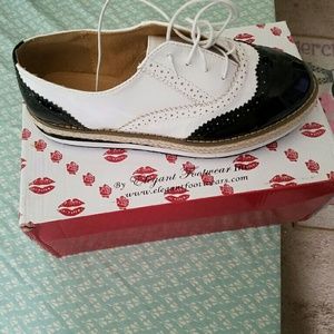 Black and white tuxedo shoes