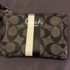Grey and black coach wristlet.