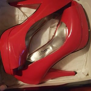 Red patent leather peep toe heels
