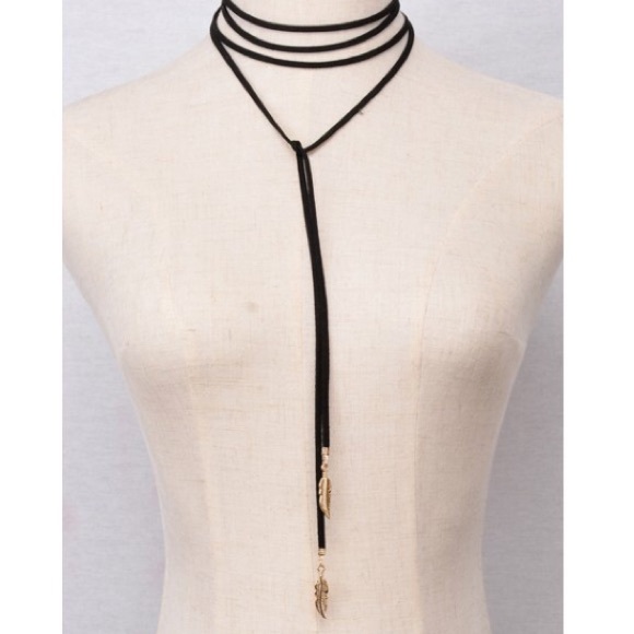 Long black choker with gold feathers.🍂✨