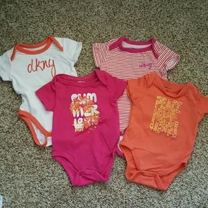 4 new DKNY baby onesies