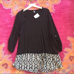Black jersey knit blouse with woven printed accent