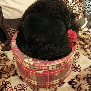 Vintage felt hat with feathers and flower.
