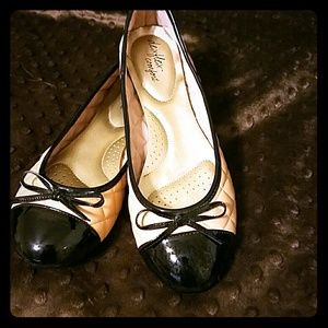 Beige and black flats